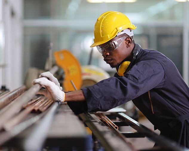 man working in a yellow hard hat
